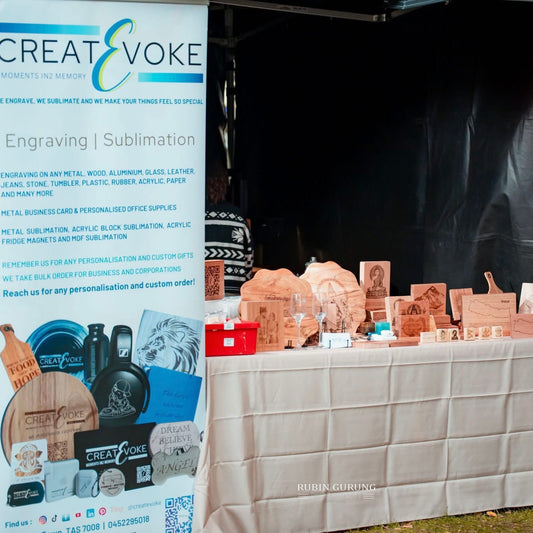 Createvoke stall at Nepal Festival Tasmania 2025 showcasing engraved wooden art inspired by Nepali culture